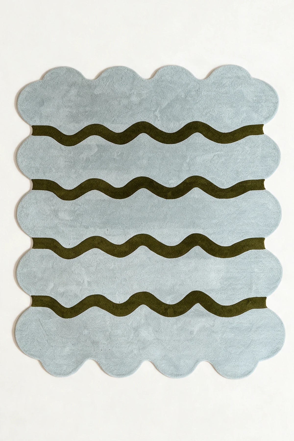 a sculpted edge hand-tufted wool rug in fog and army, shown flat from above
