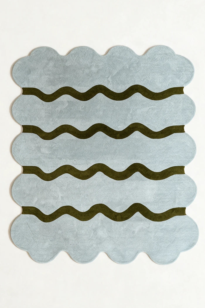 a sculpted edge hand-tufted wool rug in fog and army, shown flat from above