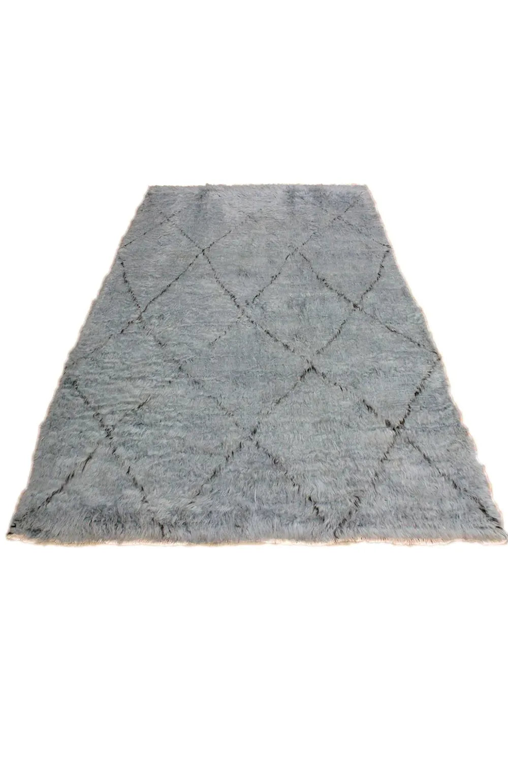 Luxurious dark gray diamond pattern on a premium shag wool rug.