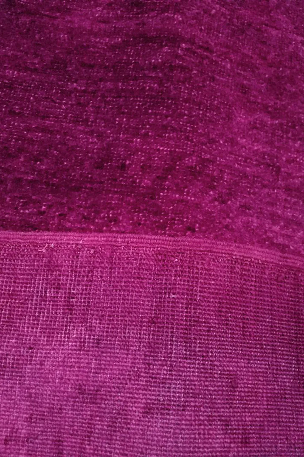 Statement Hot Pink Bedroom Rug, hand-knotted for a luxurious underfoot experience.