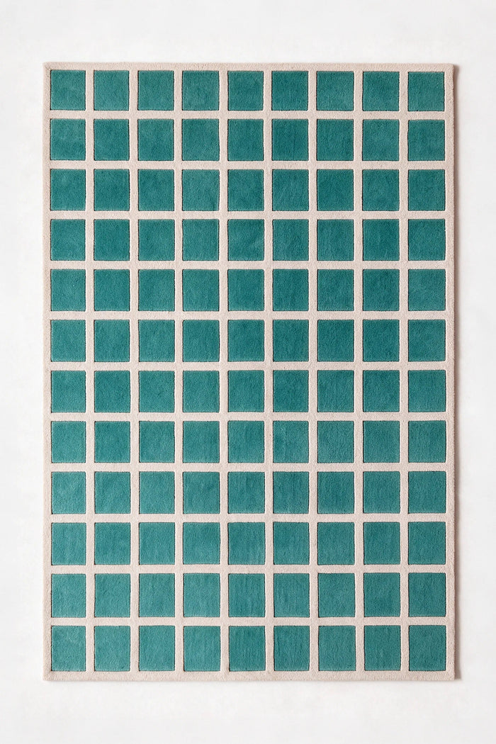 a tile hand-tufted wool rug in oat and teal, shown flat from above