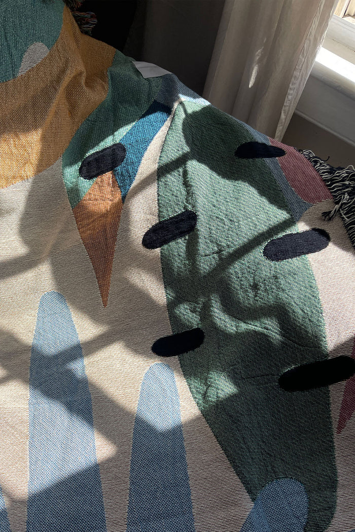 Tropical Paradise Abstract Geometric Cotton Woven Throw Blanket showcasing a vibrant abstract design with tropical colors.