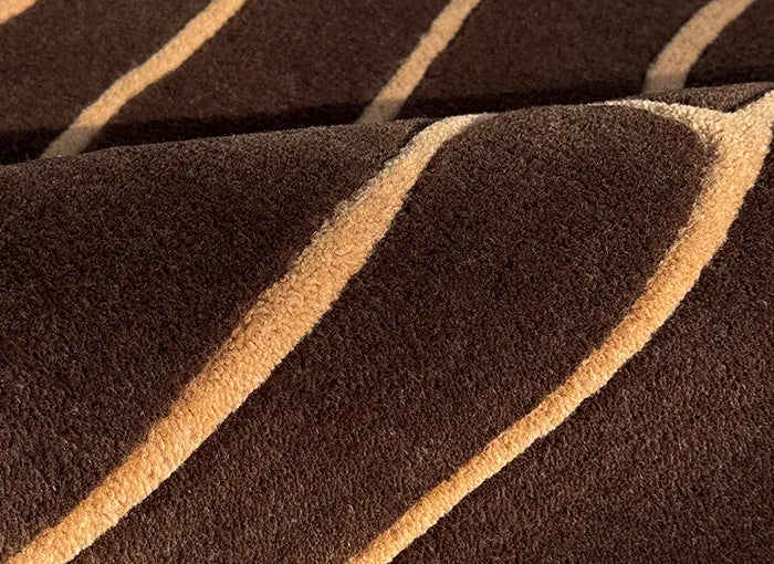 Close-up of dark brown rug with beige stripes