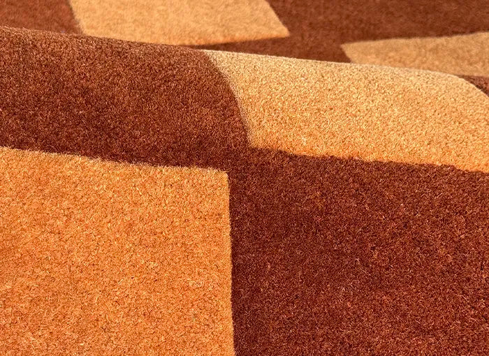 Close-up of brown and beige carpet texture