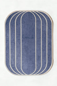 a vault hand-tufted wool rug in dusty blue and oat, shown flat from above