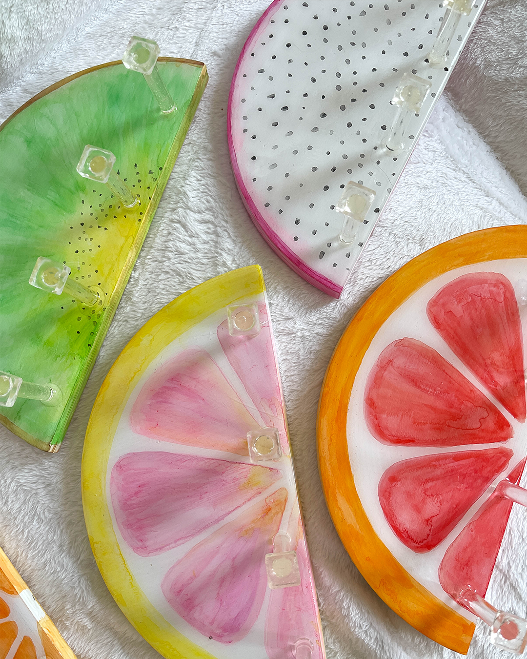 Hand-painted pink grapefruit design on a wooden key holder with multipurpose hooks.