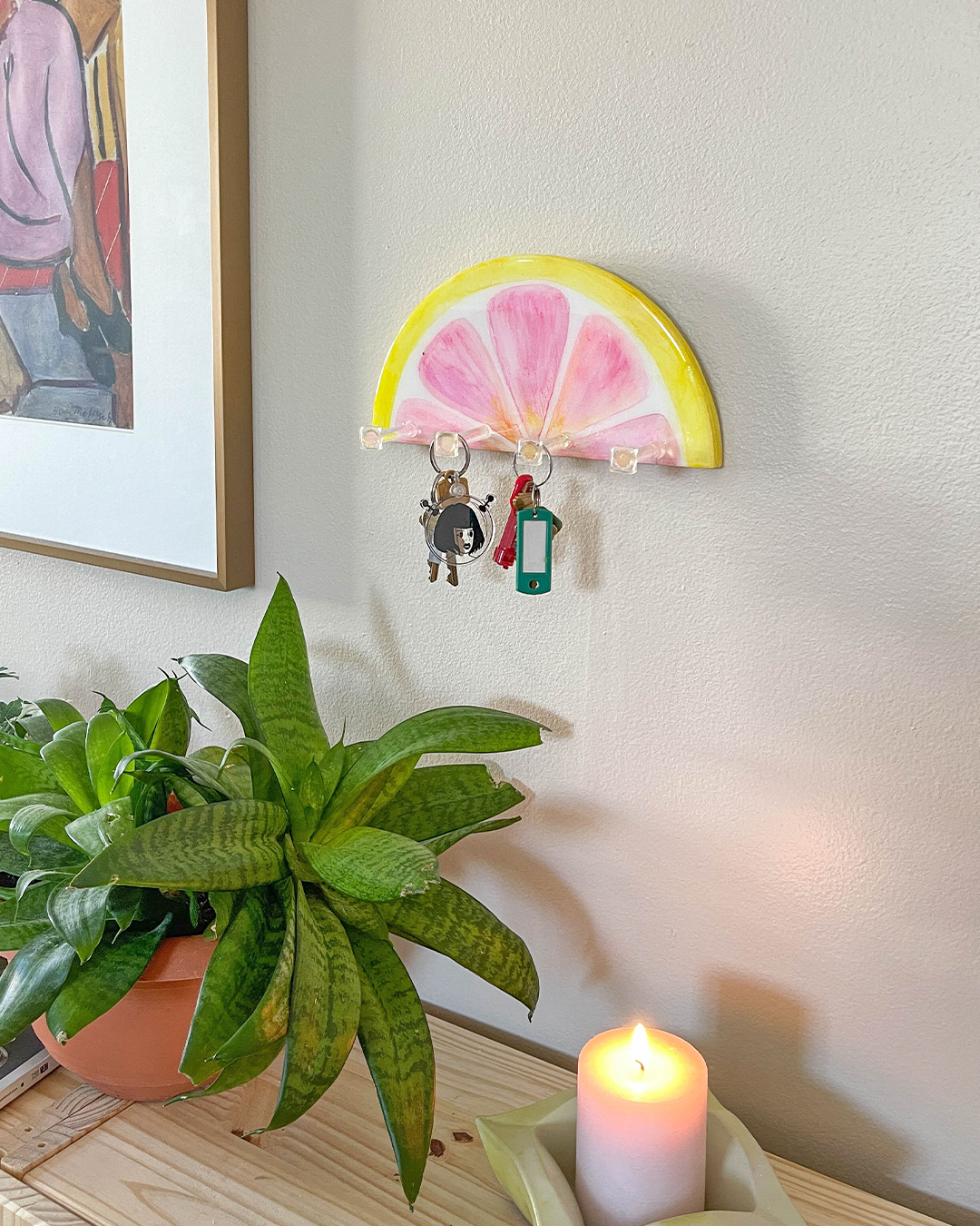 Unique pink grapefruit-inspired key and jewelry wall hanger in a bright, hand-painted design