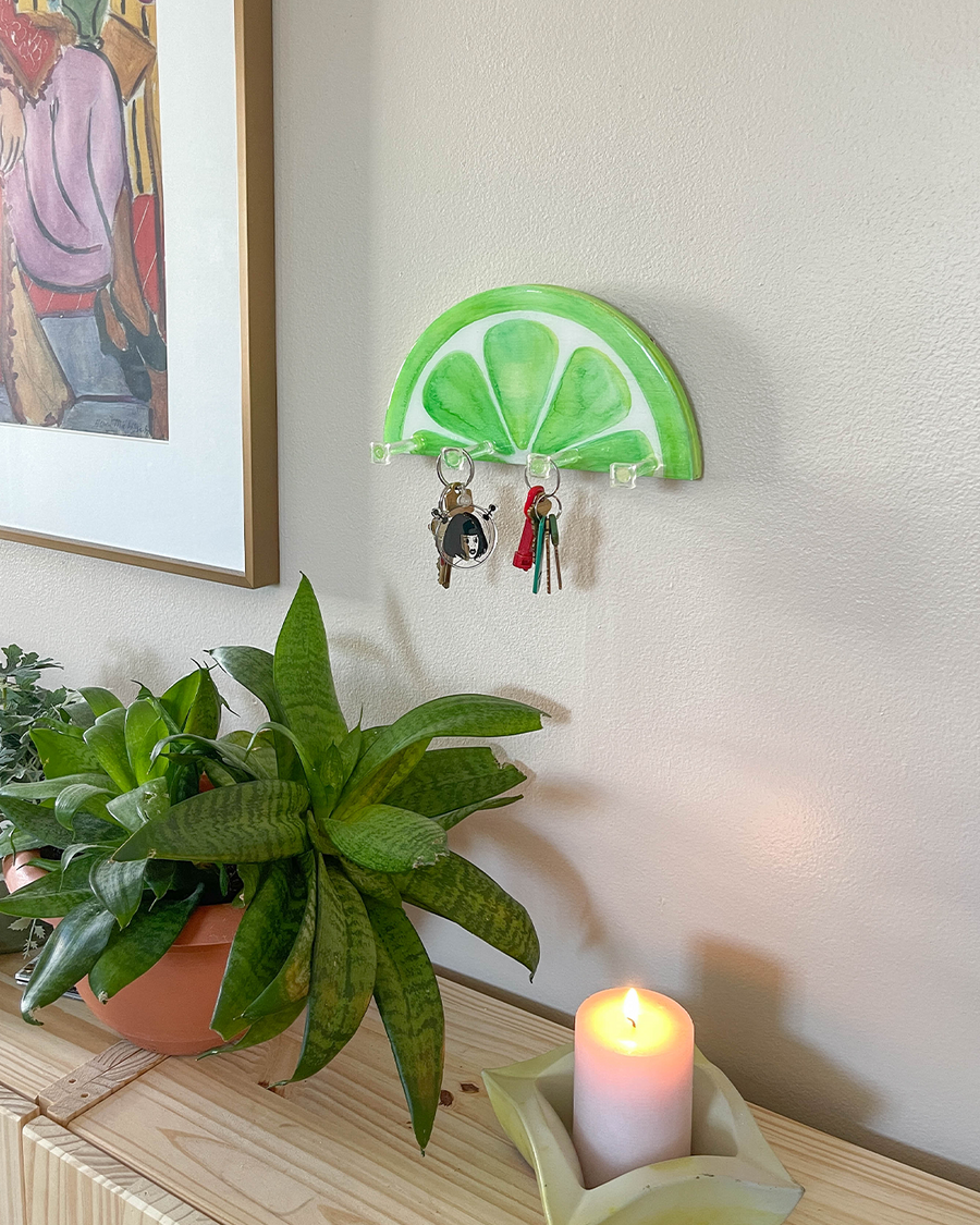 Unique hand-painted key holder inspired by a lime slice, adding a refreshing and vibrant look to any wall