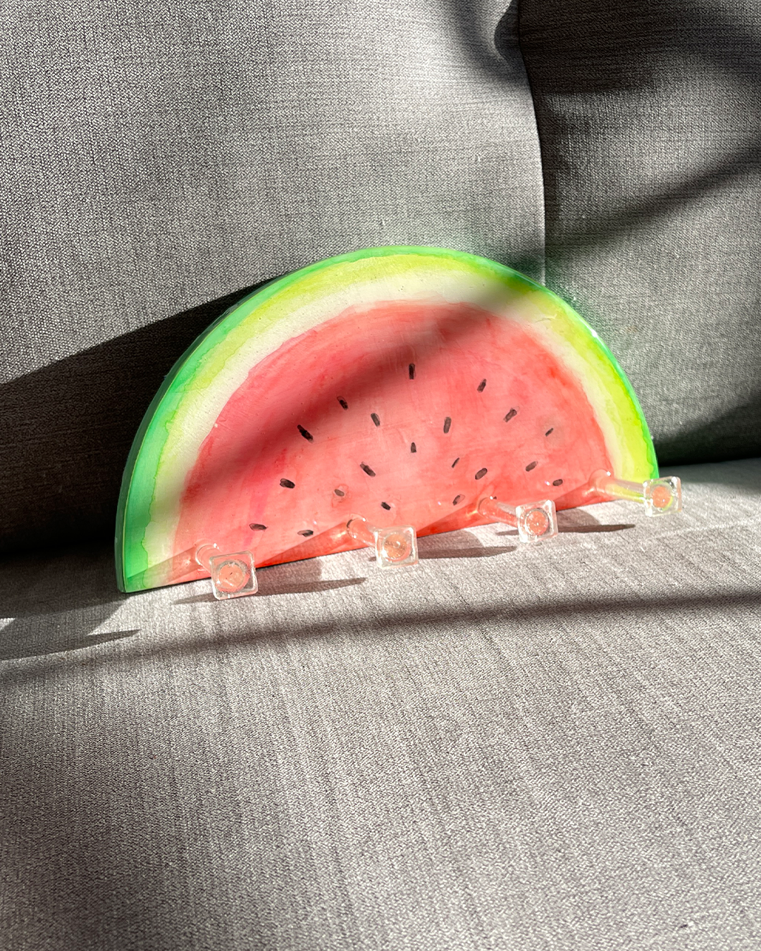 Lightweight and easy-to-install watermelon design key holder, equipped with D-rings for various hanging options.